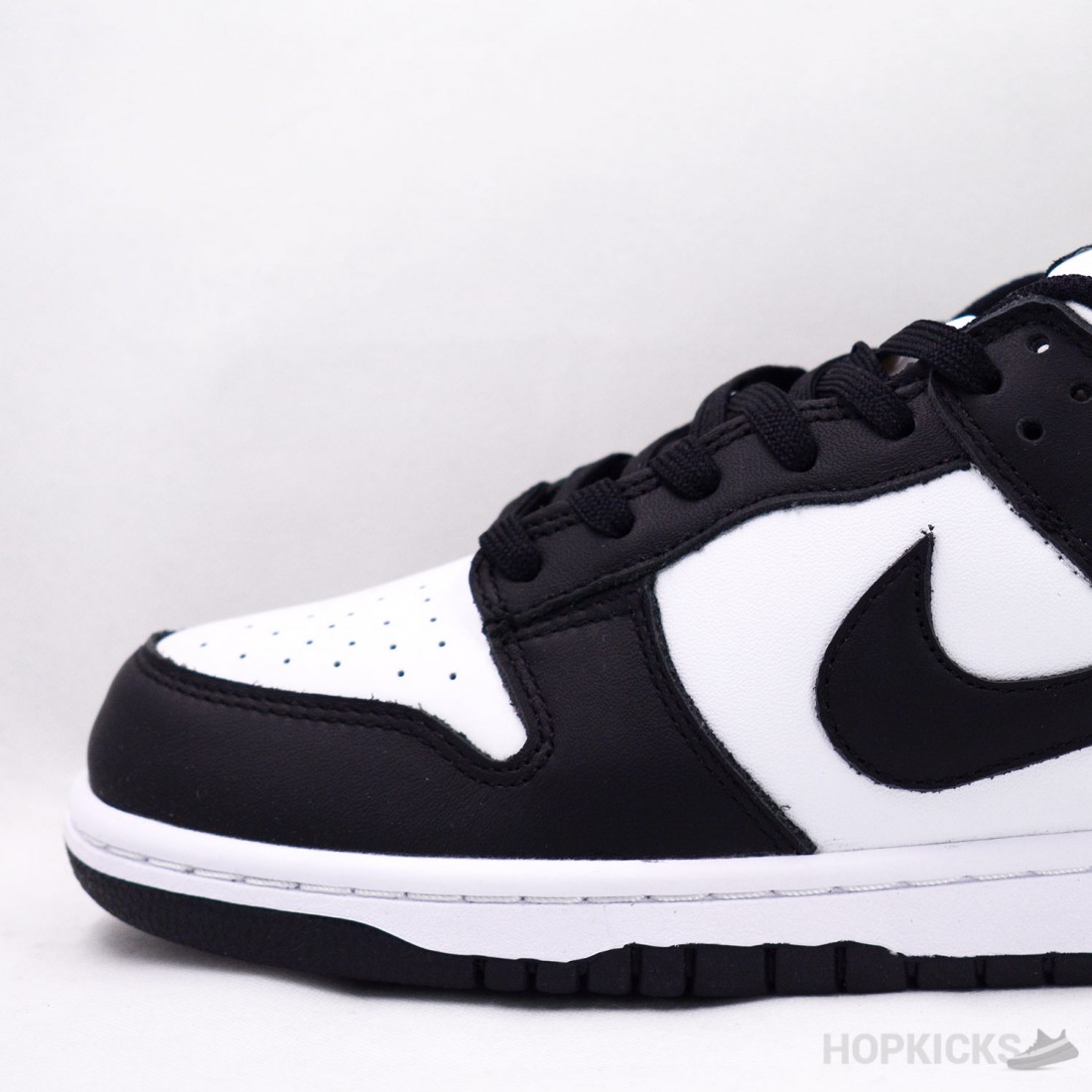 restock dunk low black white